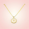 Gold and pearl cross necklace